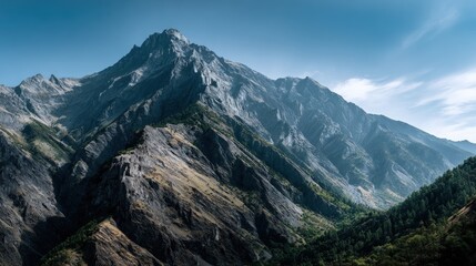 Majestic mountain range under a clear sky.