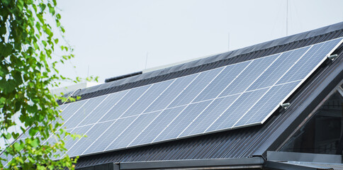 Solar panels installed on the rooftop, harnessing sunlight to generate clean and renewable energy for sustainable living.
