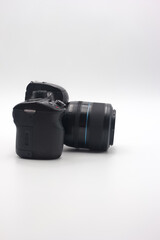 Compact digital camera with lens positioned on a white background showcasing design details and features for photography enthusiasts