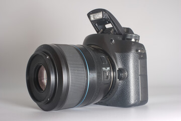 High quality DSLR camera on a light background showing detailed features and modern design