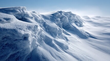 Wind sculpted snow formations on a wintry landscape.