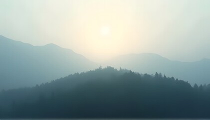 Fototapeta premium Sun breaking through foggy mountains