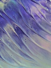 abstract background of acrylic paint in blue and purple tones. macro