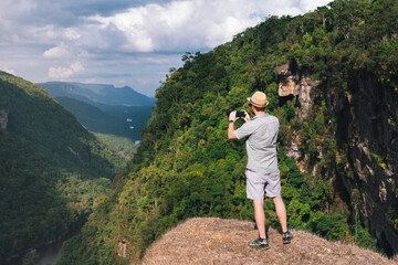 Man standing next to Kaieteur Falls in Guyana 