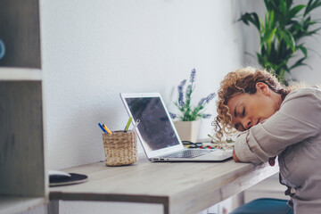 Curly-haired woman in her 40s using a laptop at home with varied expressions. Remote work, digital...