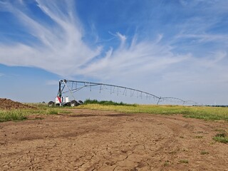 water sprinkler irrigation system, Farming field with irigation systems.Large centre pivot...