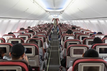 Snapshot of people boarding a plane.