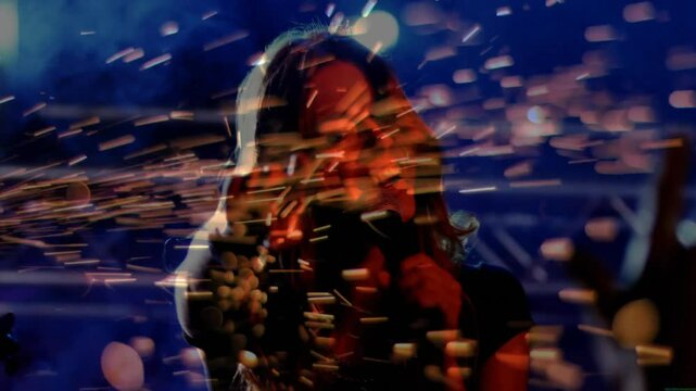 Pyrotechnic device emitting golden sparks initiating singer adjusting mic and singing in music show