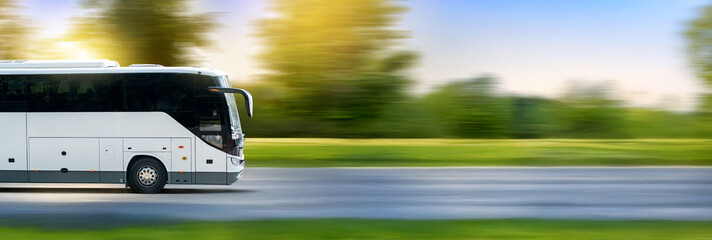 Bus driving on the asphalt road in countryside