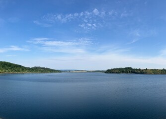 Sunny View of the Slezská Harta Reservoir in the Czech Republic – Mountain Landscape and Blue Sky in the Background