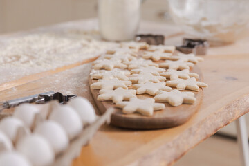 Star shaped raw cookies ready to bake. Baking sheet uncooked biscuits homemade cakes and...