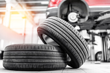 Car wheel service with lifted vehicle for tire maintenance in garage