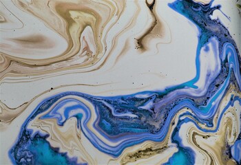 Marble abstract acrylic background. Blue marbling artwork texture. Agate ripple pattern. Gold powder.
