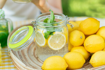 Plate with ripe fresh lemons and lemonade sassy water. Vitamins concept. copy space. Strengthening...