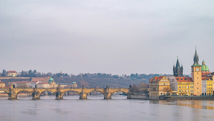 Prague, Czech Republic. Prague's iconic Charles Bridge spanning the Vltava River, showcasing its historic arches and statues with the Old Town Bridge Tower