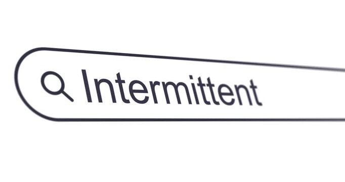 Typing words Intermittent Fasting into search box, looking for time-restricted eating information, search bar close-up, footage