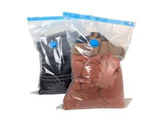 Two clear vacuum seal bags filled with clothing and blue air valve isolated on transparent background