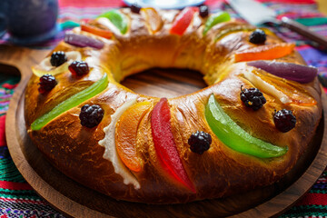 Delicious rosca de reyes recipe traditional mexican kings cake with candied fruit and blackberry topping