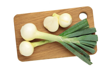 Green onion on cutting board isolated on white background.