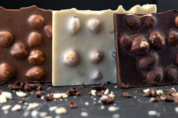 Chocolate bars standing upright with out-of-focus chocolate shavings