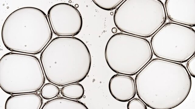 Bubble cluster transparent, cells under a microscope on white background. Gel texture with bubbles, skin care product. Macro Shot of Natural Organic Cosmetics, Medicine. High quality 4k footage