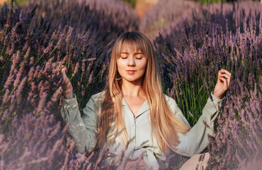 Woman Practicing Meditation and Breathing Exercises in Lavender