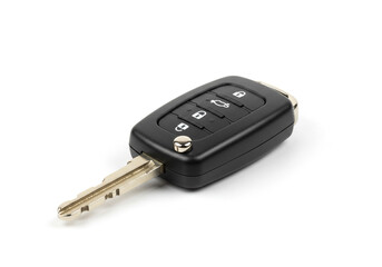 A close up shot of a modern car key with remote control buttons on a white isolated background