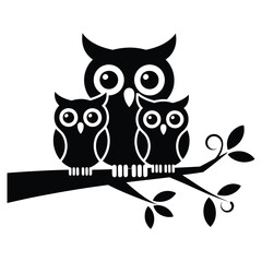 Fototapeta premium Three black owls sitting on a tree branch family