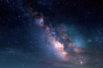 Fototapeta premium Stunning view of the night sky showcasing the Milky Way galaxy over a tranquil landscape at dusk near a remote location