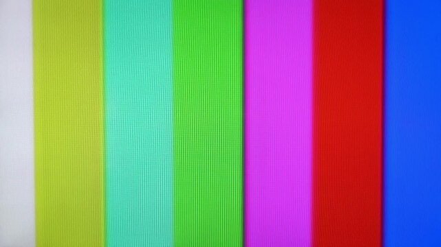 A vintage television screen displays colorful test pattern bars