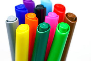 A group of felt tip pens with pen covers