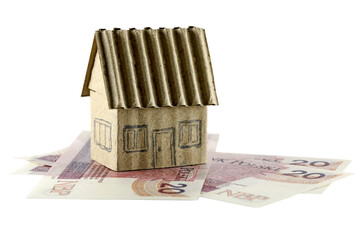 A miniature of a detached house and the Polish Zloty banknotes