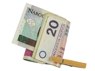 Clothespin holds folded Polish zloty banknotes