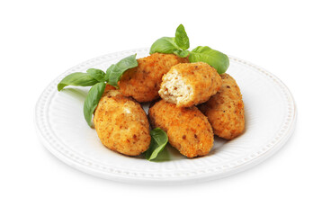 Tasty fried croquettes and basil isolated on white