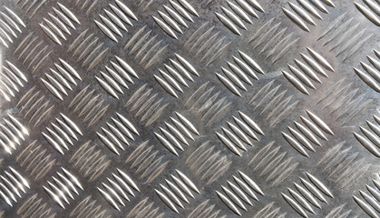 Corrugated metal sheet for flooring. The floor is made of metal with stripes.