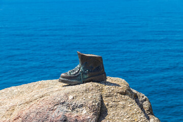 The boot of Cape Finisterre in Galicia, Spain. The bronze boot marks the end of Saint James Way