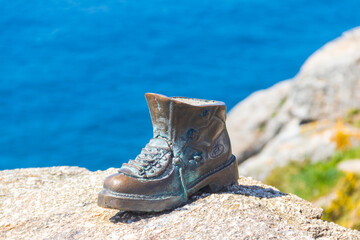 The boot of Cape Finisterre in Galicia, Spain. The bronze boot marks the end of Saint James Way