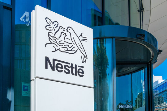 office Nestle with logo, milk company, food manufacturer, instant coffee, chocolate, dairy products, pet food, pharmaceuticals professional business in Frankfurt, Germany