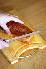 Homemade loaf of poppy seed bread on wooden cutting board