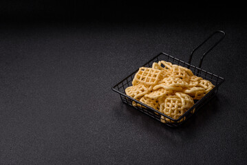 Lattice or wafer potato chips, crispy yellow snacks, takeaway food
