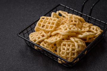 Lattice or wafer potato chips, crispy yellow snacks, takeaway food