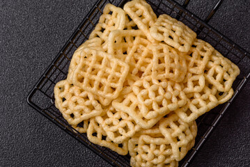 Lattice or wafer potato chips, crispy yellow snacks, takeaway food