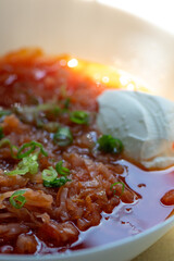 Traditional homemade borscht with sour cream and beef in white bowl
