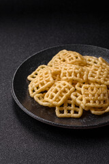 Lattice or wafer potato chips, crispy yellow snacks, takeaway food