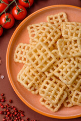 Lattice or wafer potato chips, crispy yellow snacks, takeaway food