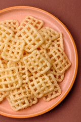 Lattice or wafer potato chips, crispy yellow snacks, takeaway food