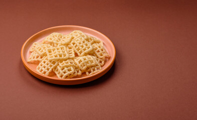 Lattice or wafer potato chips, crispy yellow snacks, takeaway food