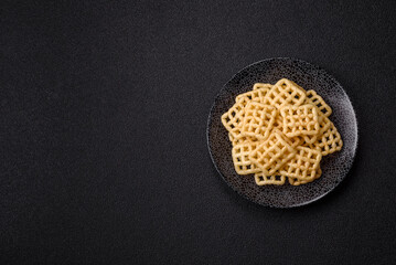 Lattice or wafer potato chips, crispy yellow snacks, takeaway food