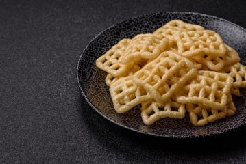 Lattice or wafer potato chips, crispy yellow snacks, takeaway food