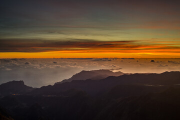 Majestic sunset over Pico do Arieiro in Madeira showcasing breathtaking mountain views and vibrant...